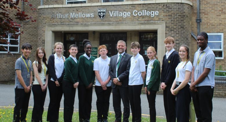 Pupils and Headteacher standing outside Arthur Mellows Vilage College