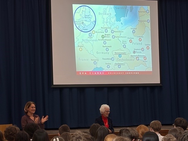 Eva Clarke in front of students